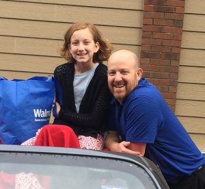 Mr. Jauss and his daughter, Katie, pose for a picture for the homecoming parade. Photo courtesy of Julie Jauss.