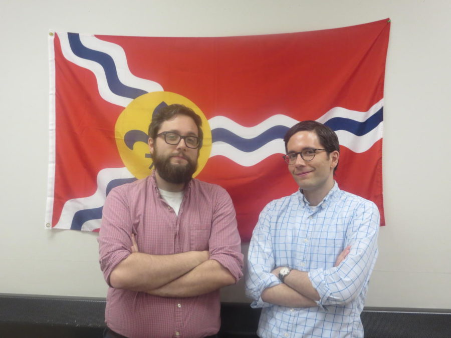 Pete and Steve Wissinger pose for a picture in front the St. Louis flag--where they both reside