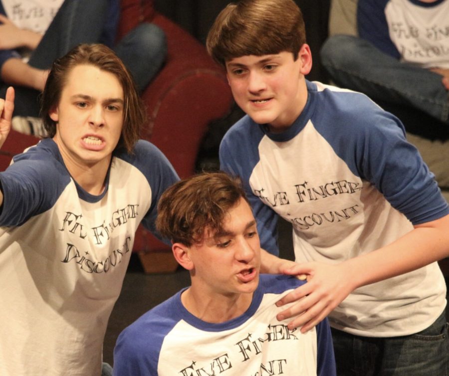 Senior Taylor Gray, junior Justin Epperly and sophomore Matthew Christofferson play an improv game during their most recent show. 