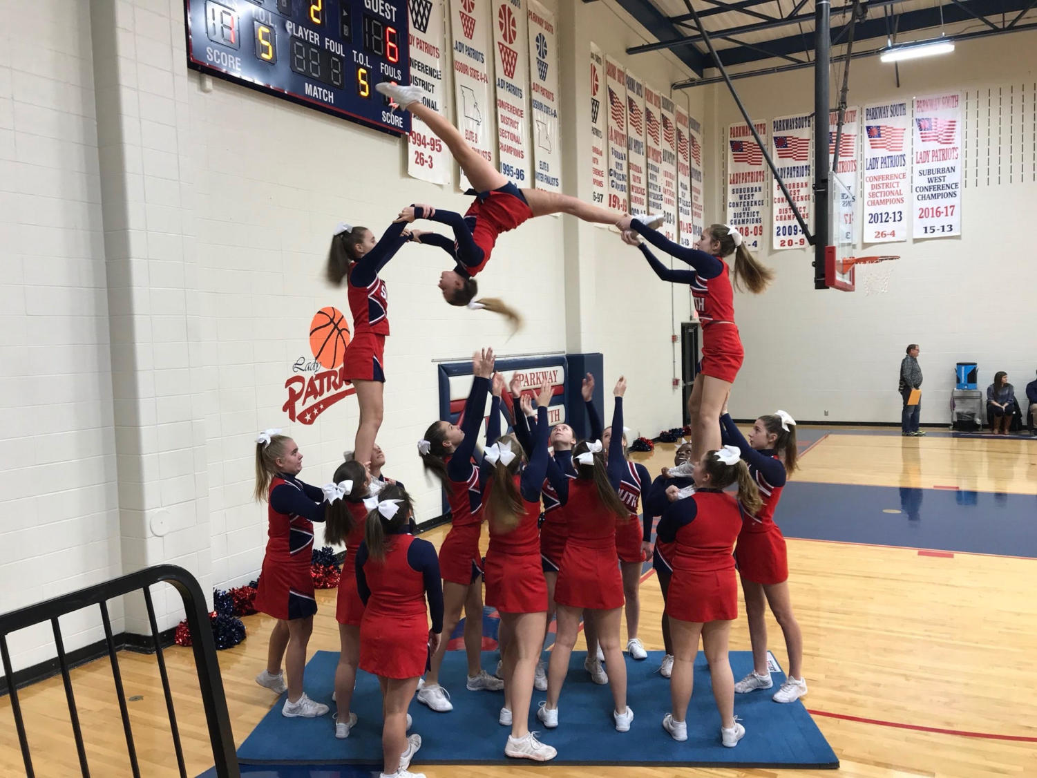 The JV cheerleading squad does its