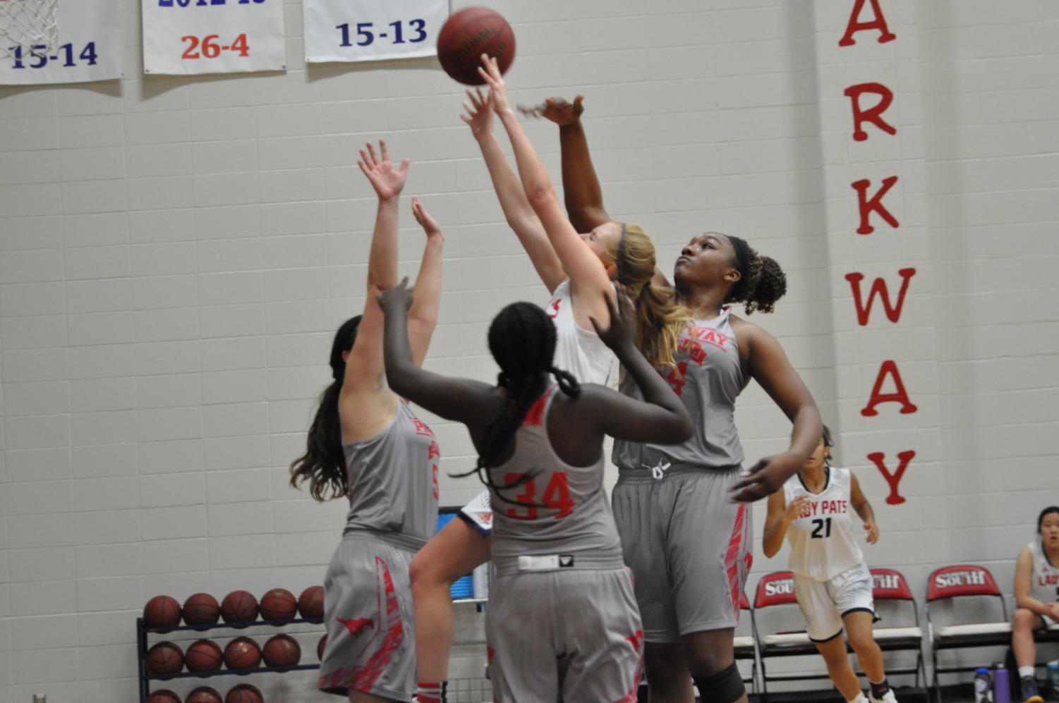 Senior guard Mia Patterson goes for a shot while being covered by three Parkway North players.