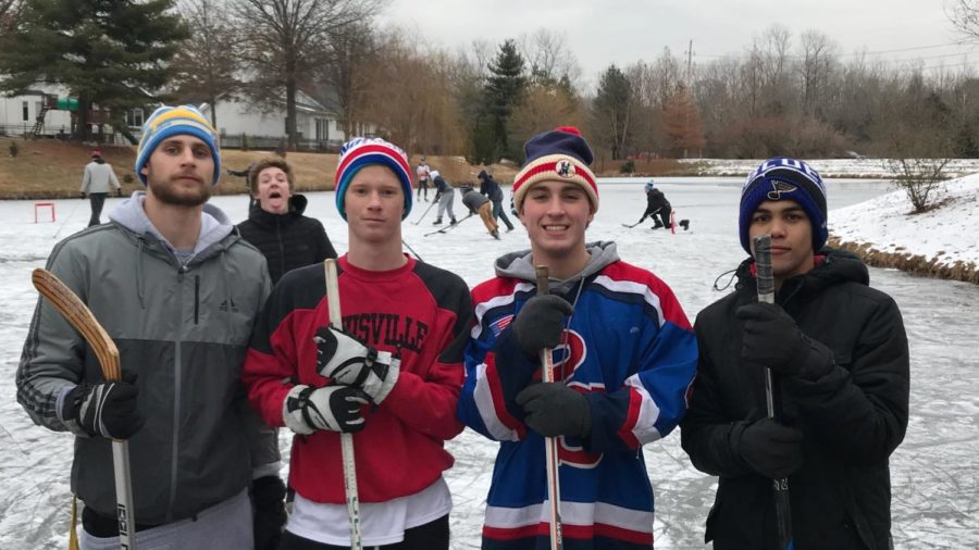Seniors+Jack+Mullen%2C+Ben+Sanders%2C+Joey+Schuman+and+Jordan+Doyle+take+a+break+during+a+hockey+game+on+the+ice+in+the+Seven+Oaks+Subdivision.+