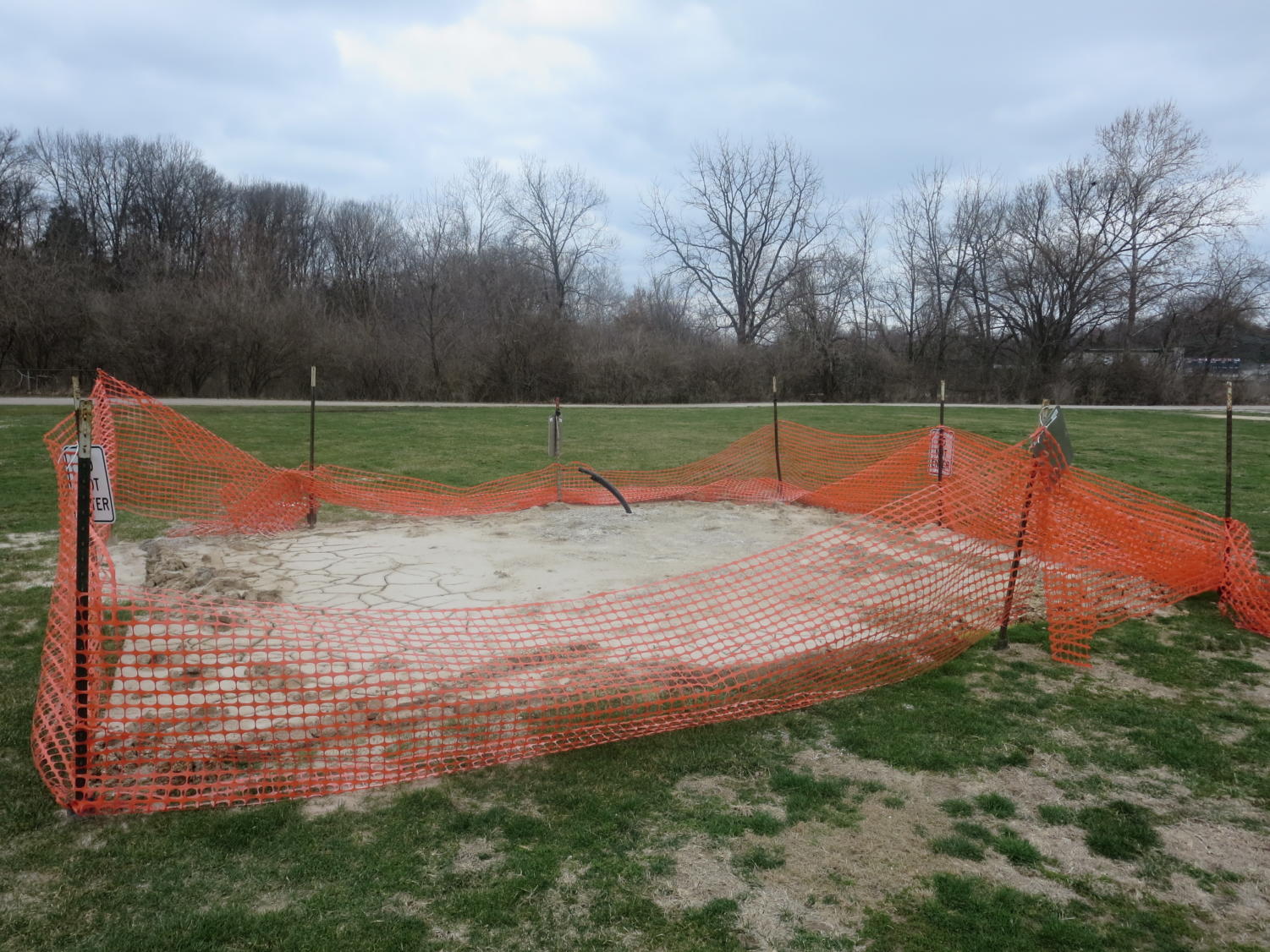 A construction fence marks off the space where test drilling has taken place for South High's geothermal system.