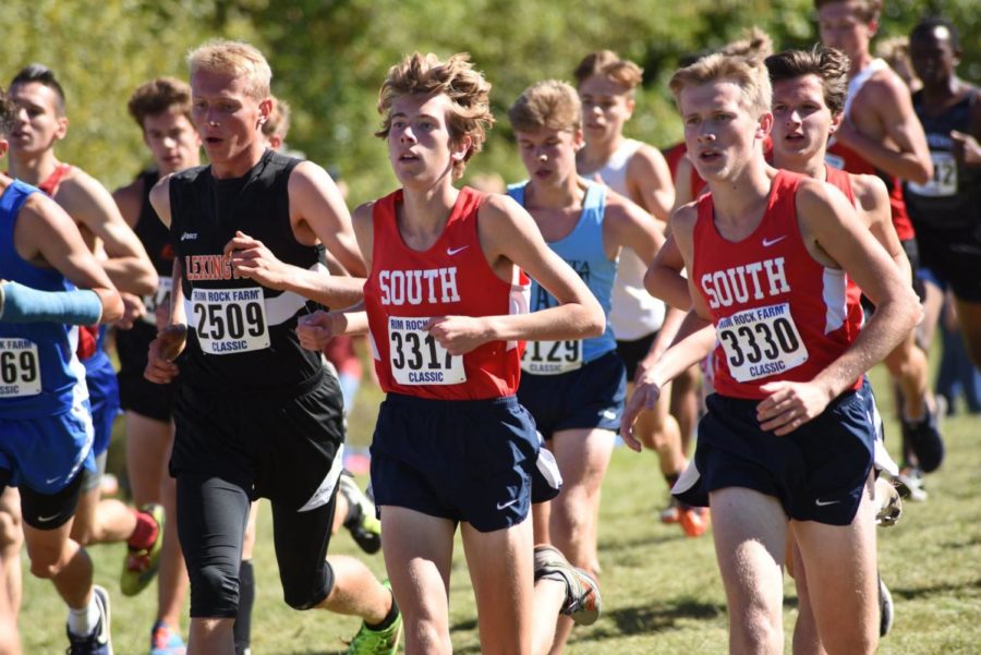 (L to R) Eric Boles, Daniel Tabaka, (off Tabakas left shoulder, to the right in photo in red) and James Stone run together in the first mile of the Rim Rock Farm Classic in Lawrence, Kansas Sept. 22.  South finished twelfth in a field of thirty-five.