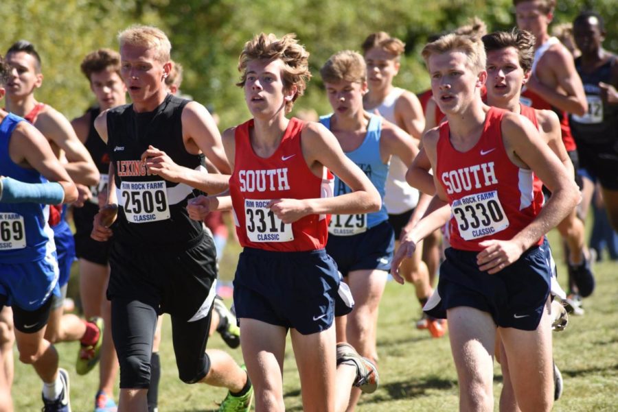 (L to R) Eric Boles, Daniel Tabaka, (off Tabaka's left shoulder, to the right in photo in red) and James Stone run together in the first mile of the Rim Rock Farm Classic in Lawrence, Kansas Sept. 22.  South finished twelfth in a field of thirty-five.