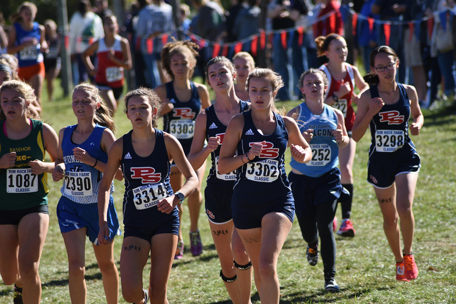 Juniors Vanessa Waidmann, Jordyn Haddrill and Sydney Hieken, and sophomores Mary Gordon and Abigail Bernath run hard at the Rim Rock Farm Classic in Lawrence, Kansas Sept. 22.