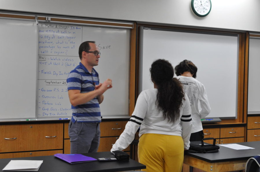 Science teacher Sergey Zinovchik chats with students during class.