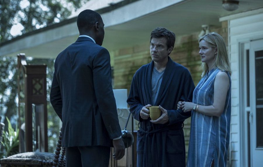 Marty and his wife, Wendy, talk to an FBI agent during an episode of Ozark.