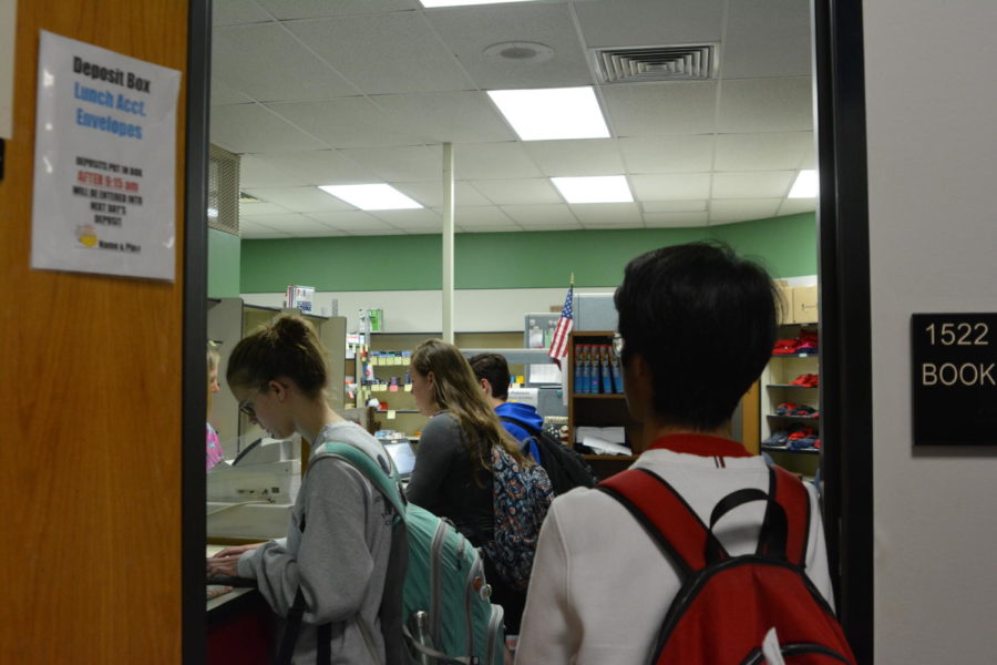 Students line up in the bookstore to purchase their $70 prom tickets.