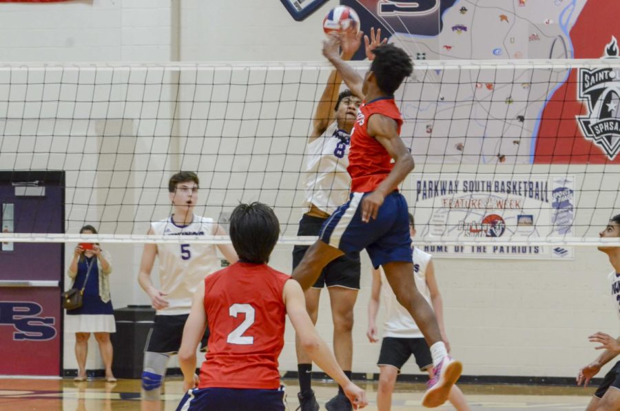 Senior Taron Jones leaps in the air to spike the ball in a game against Parkway North.