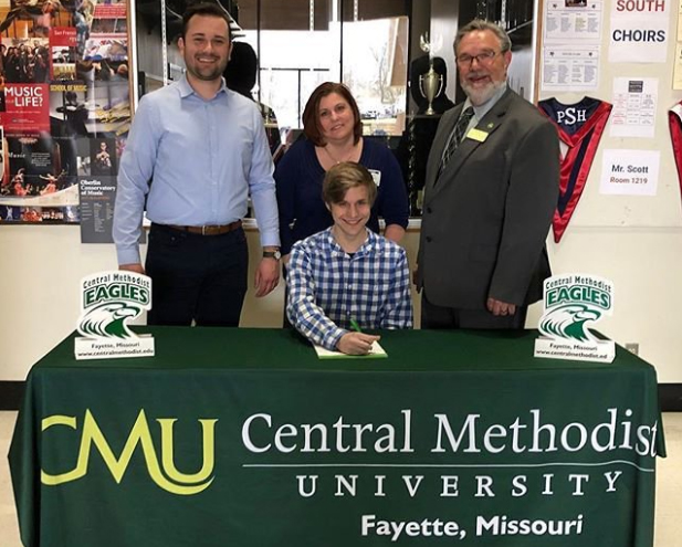 Senior Nathan Wren signs his scholarship to Central Methodist.