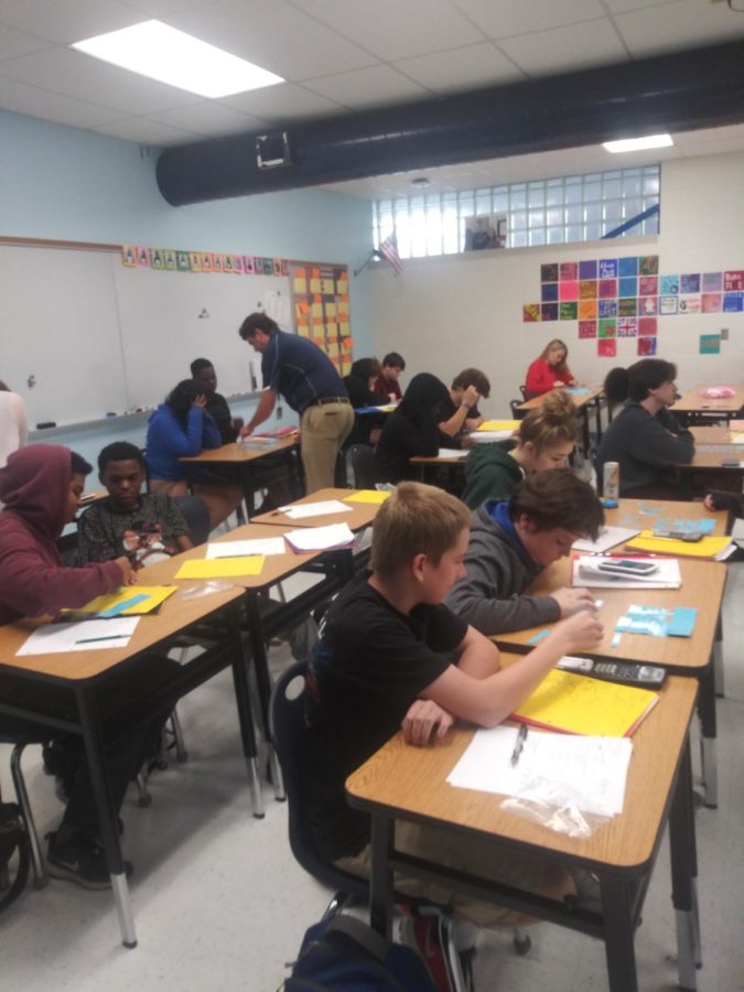 Students work in Jamie Dressers third block Geometry class. Next year students will likely have to wait till January to take their first semester finals. 