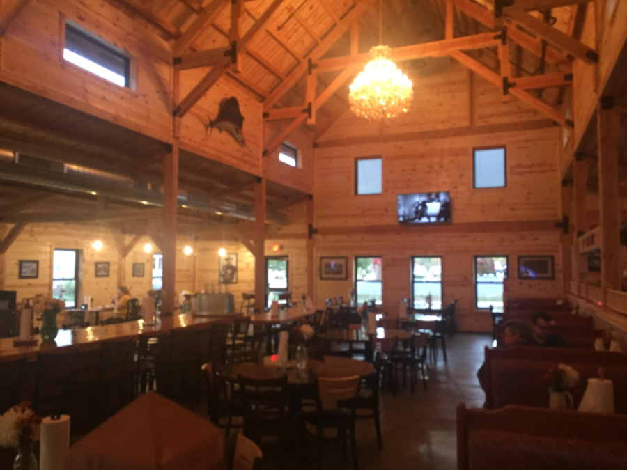 The inside of the Manchester location of Smokee Mos simulates a barn theme. 