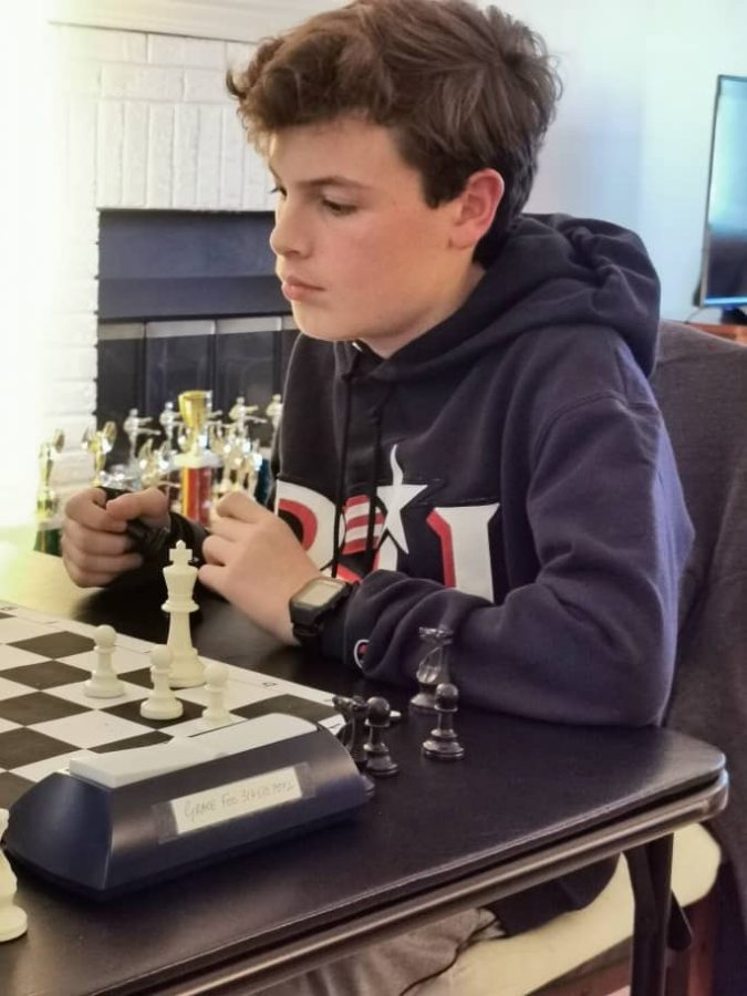 Freshman Cole Tatro studies his next move during a recent chess match.