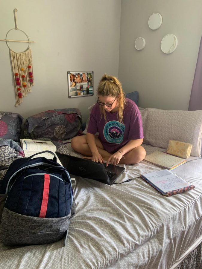 Junior Paige Kehlenbrink works on her e-learning in her bedroom. 