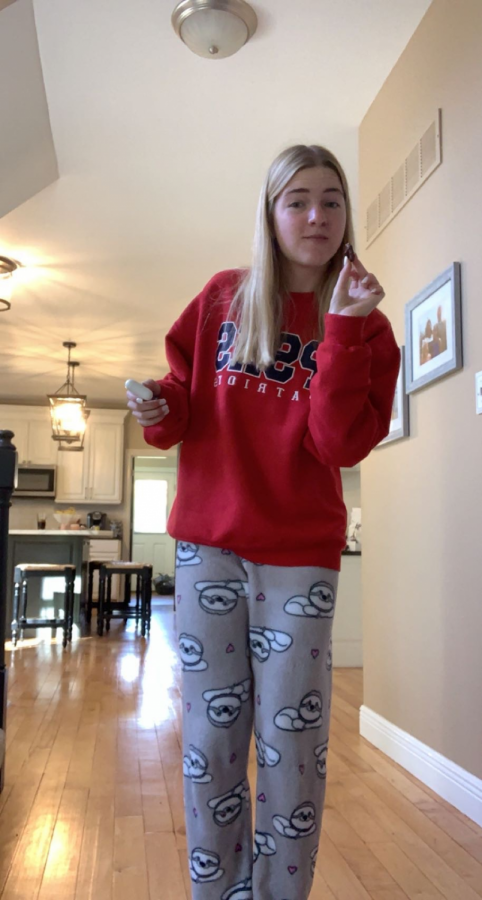 Sophomore Caroline Knolhoff shows off her sloth pajama pants during virtual learning.