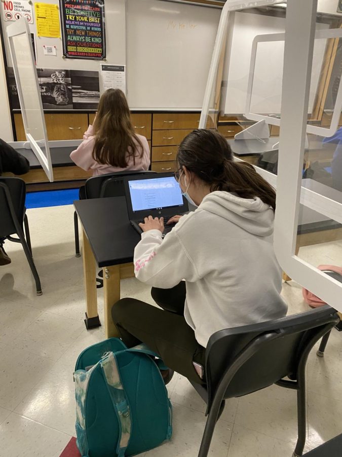 Junior Mia Hadziselimovic concentrates in her Chemistry class. 