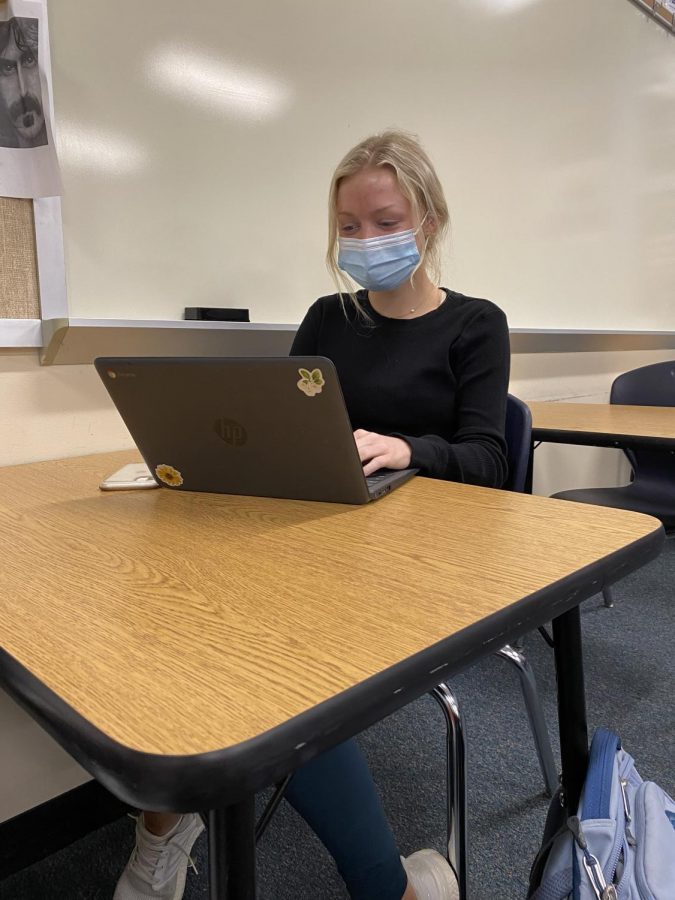 Sophomore Sophie Medlock works on her Chromebook in her U.S. History class. Medlock chose the in-person learning option.