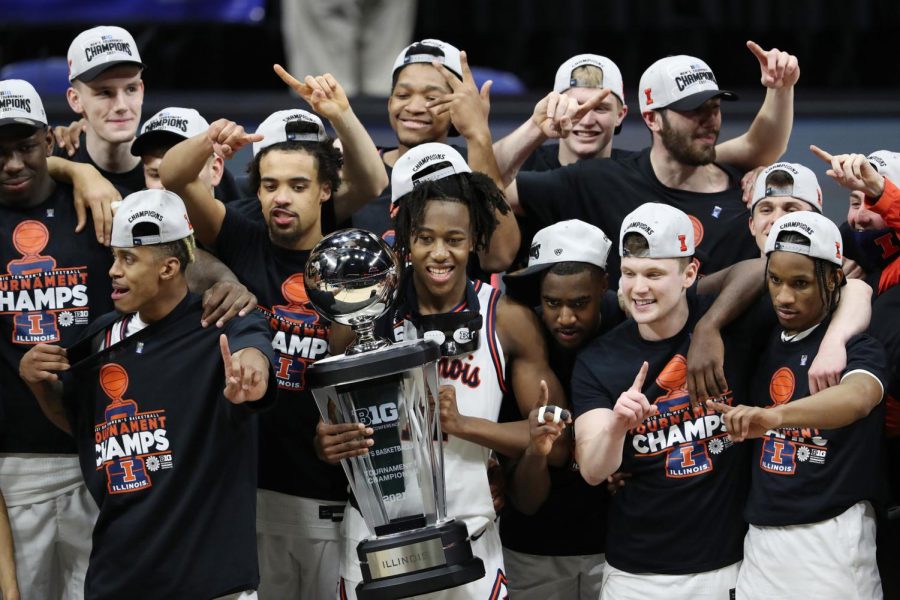 The+Illinois+Fighting+Illini+celebrate+a+91-88+win+over+the+Ohio+State+Buckeyes+in+the+Big+Ten+mens+basketball+tournament+championship+game+at+Lucas+Oil+Stadium+Sunday%2C+March+14%2C+2021%2C+in+Indianapolis%2C+Indiana.