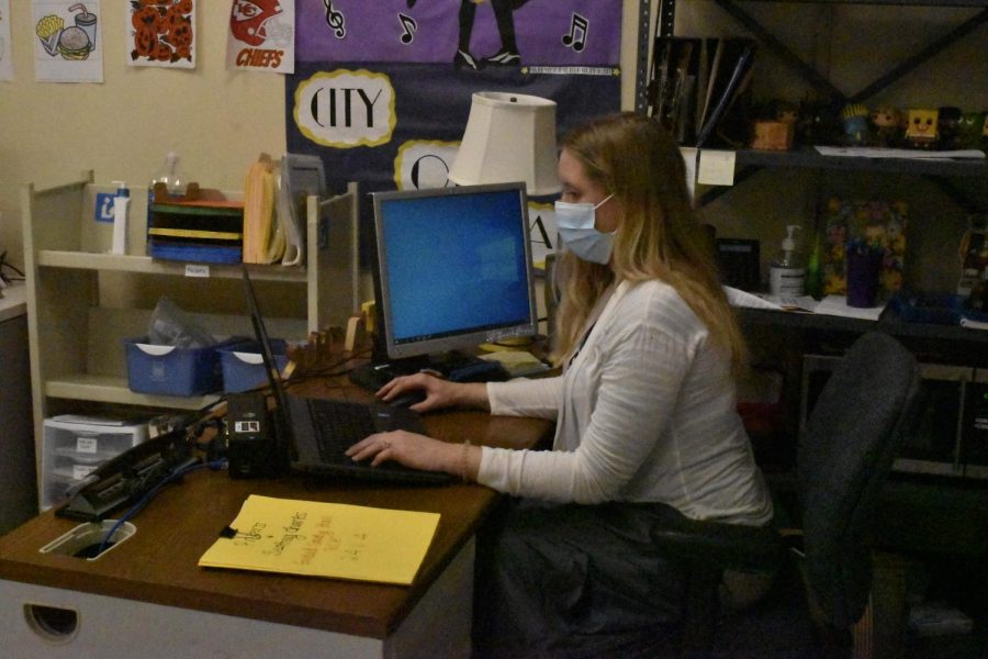 Teacher Assistant Gretchen Joyner works at her desk on Thursday, Nov. 4. Joyner is supervising lunch detentions on purple and blue days.