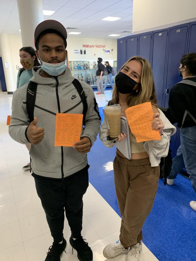 Seniors Carlos Henderson and Jordan Dix show their orange cards during one of the rare academic labs this semester.