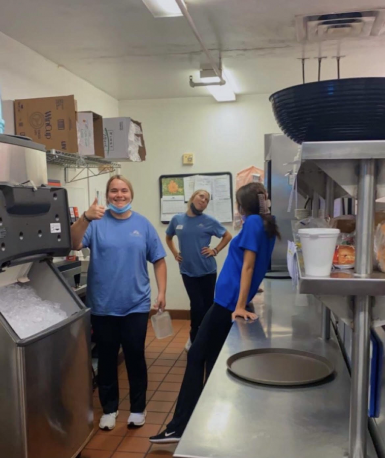 Juniors Chelsea Bles, Sydney Buehrer and Sophie Ellington enjoy their shift in the kitchen at Cape Albeon.