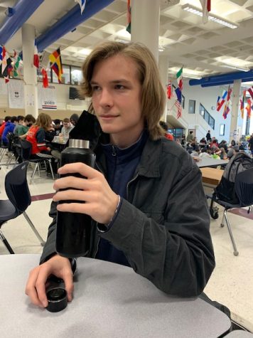 Junior Reese Rich takes a drink from his coffee thermos. Rich has to bring his caffeine from home because South doesnt provide any.