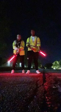 Seniors Alex Linson and Chelsea Bles have some fun after their shift is over at Hollywood Casino Amphitheater. Linson and Bles were helping to direct traffic into the concert venue. 