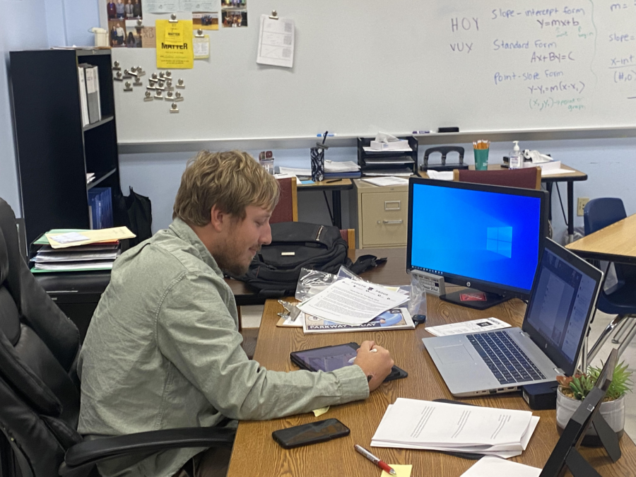 New math teacher Jacob Mertz teaches his virtual class from his desk in the math wing. 