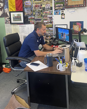 Social studies teacher Adam Weiss works on grading during his planning period. Weiss teaches AP Human Geography, which is available for freshmen to take. 