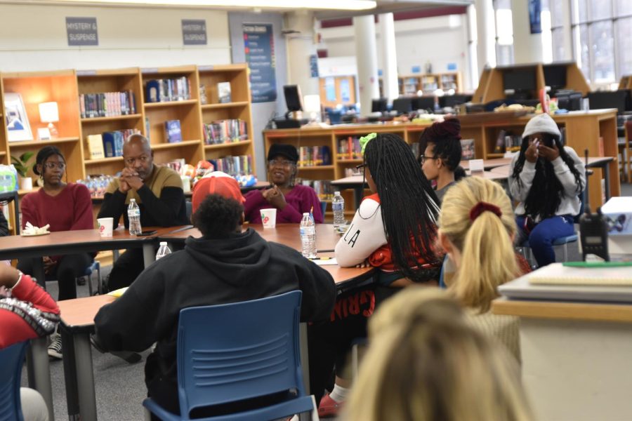Students engage in a conversation with the parents of Assistant Principal Brionne Smith, and talk about black resistance. ASAP sponsored the discussion. 