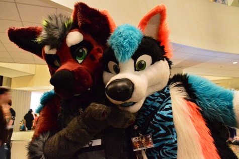 Two people dressed as Furries hang out at the 2015 Furry Weekend convention in Atlanta.