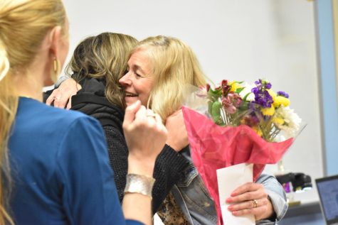 Math teacher Anne Erehart gets a congratulatory hug after learning she is District Teacher of the Year for Parkway.