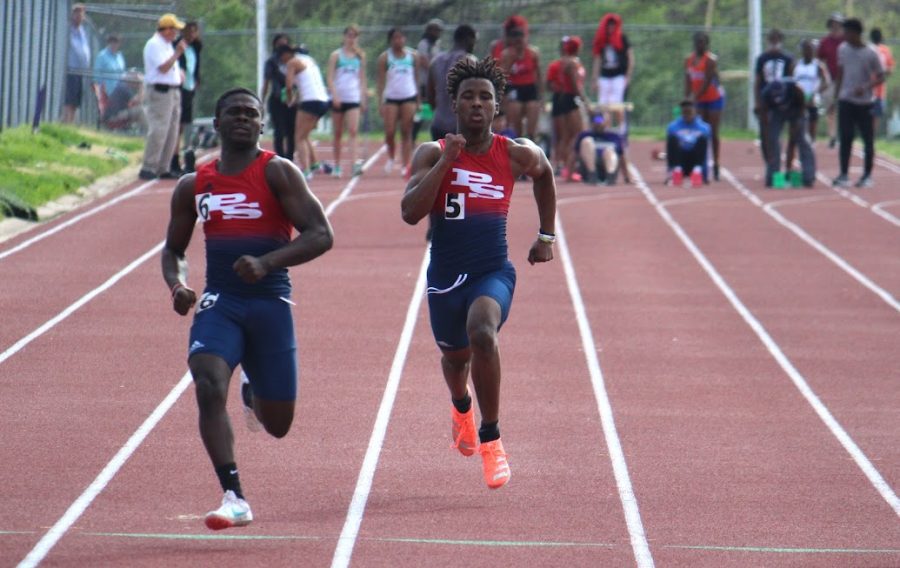 Senior sprinters LaRon Eason and Pierce Bryant burn up the track during an event last year.
