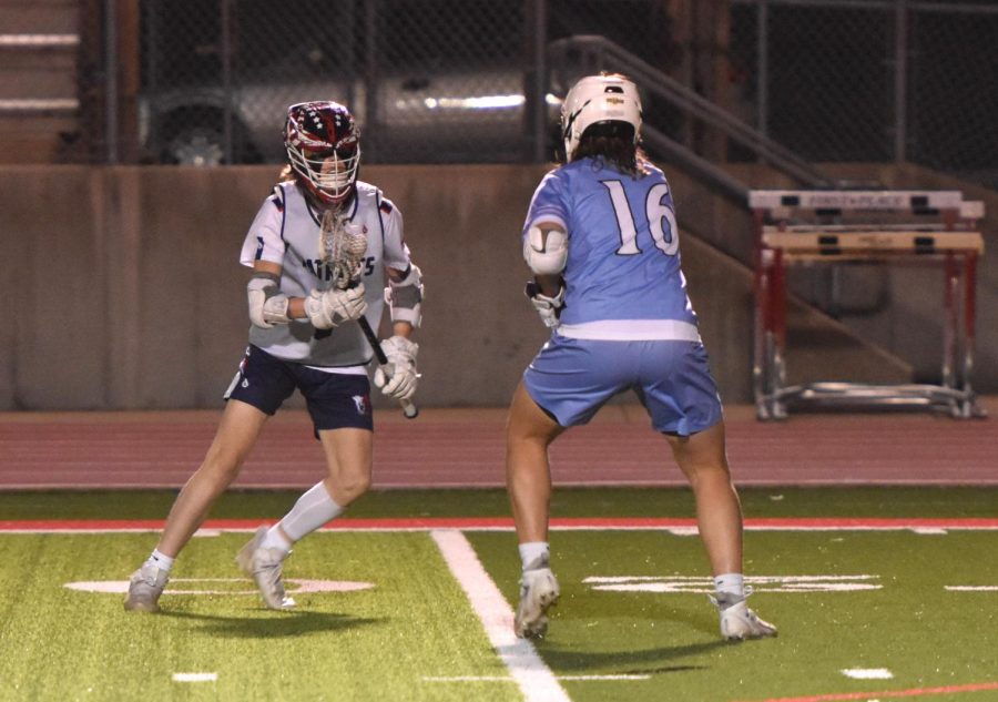 Sophomore+Brody+Gilreath+dodges+his+defender+to+go+to+the+goal+during+a+recent+lacrosse+game.+Photo+by+Izzy+Puccio