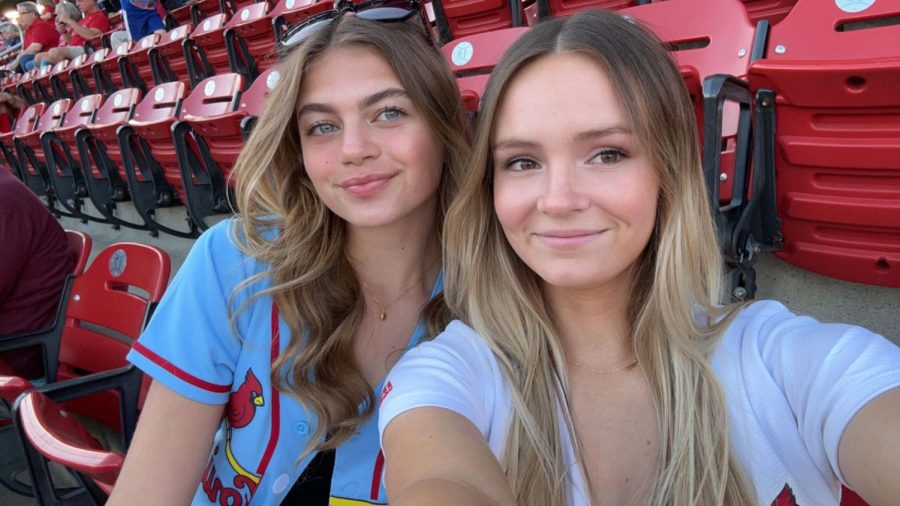 Junior Cardinal fans Brooke Oberkramer and Caitlyn Schmitt take a selfie while having fun at a Cardinals game this season. 