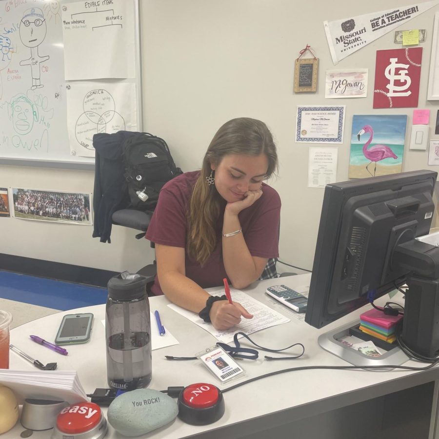 Science teacher Meghan McGowan works on grading final exams during her planning period. Next year, teachers will have less time to plan. 