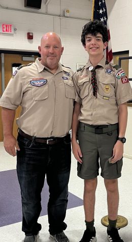 Counselor and Eagle Scout Rob Lappin takes a picture with his son, Grant, who is also in Boy Scouts.
