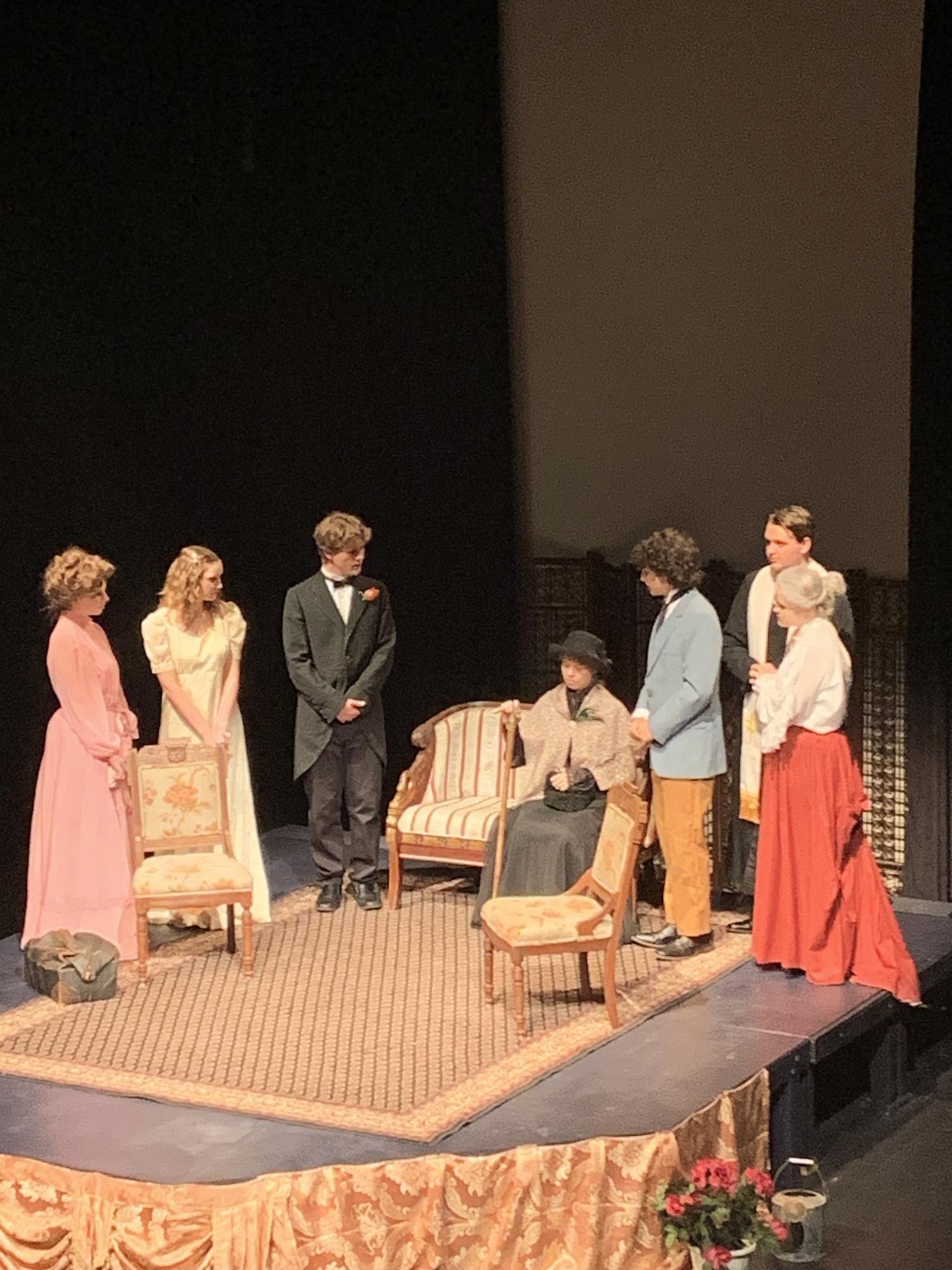 Upperclassmen cast members learn about the history of John Worthing in the play The Importance of Being Earnest, by Oscar Wilde. 