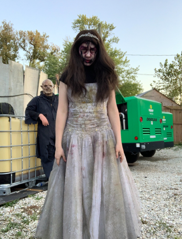 Senior Kyra Rhoades shows off her Prom Queen costume. Rhoades is a scare actor at Creepyworld.