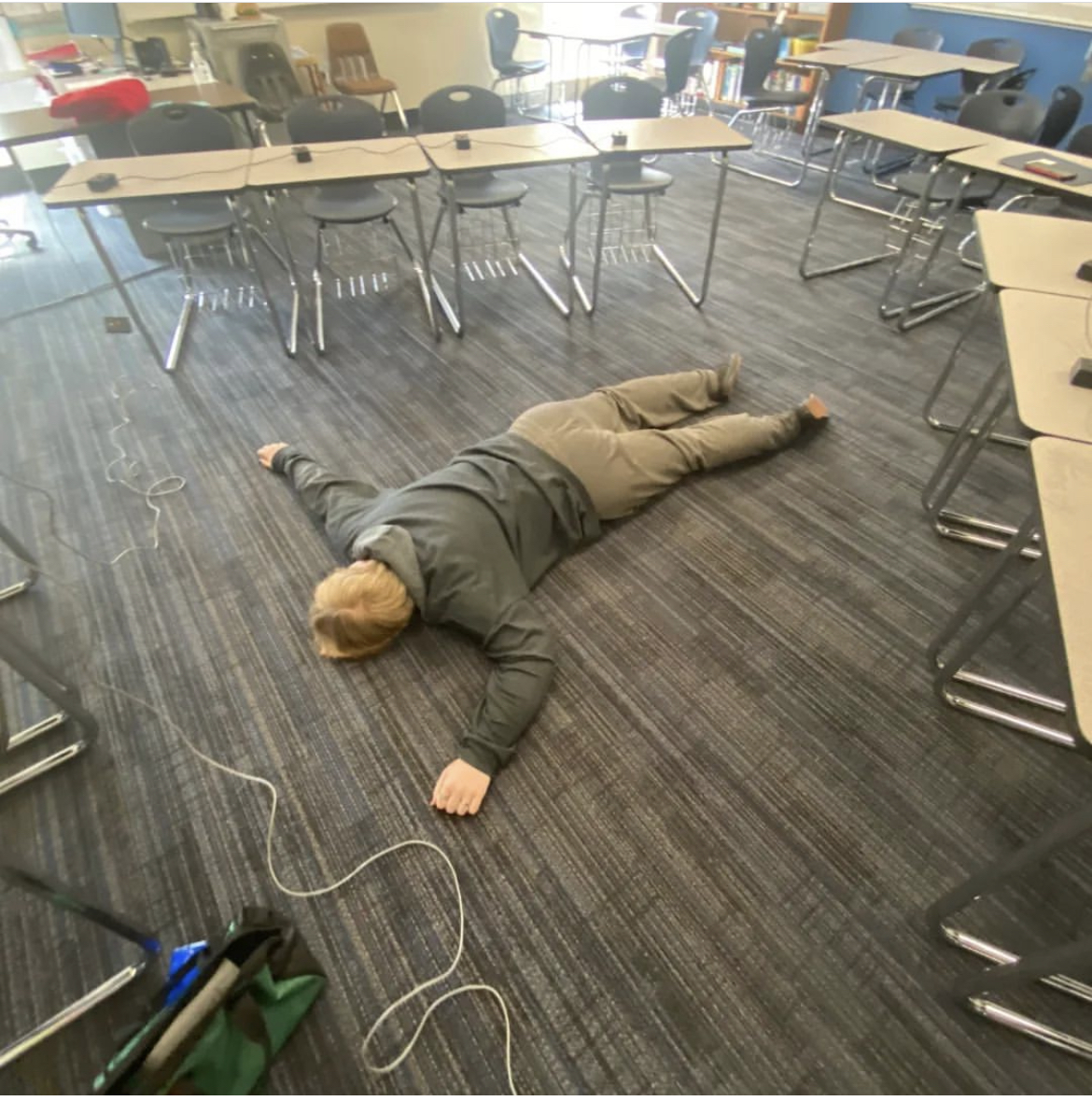 Junior Connor Farnsworth lays down, exhausted after the teams first competition of the year. South High took 6th place in the Parkway Academic Kickoff Tournament on Oct. 7.  Courtesy of @pshscholarbowl on Instagram.