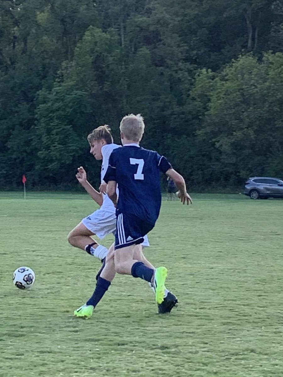 Freshman Drew Birkenholz chases down an opponent during a Patriot C-team soccer game this fall. Starting Jan. 1, Birkenholz will be a member of the King Julian FC indoor soccer team.