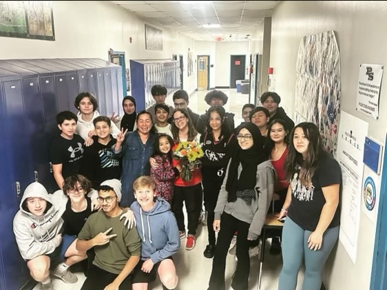 Jillian Baldwin-Kim takes a picture with her students after being declared the Teacher of the Year for South High.