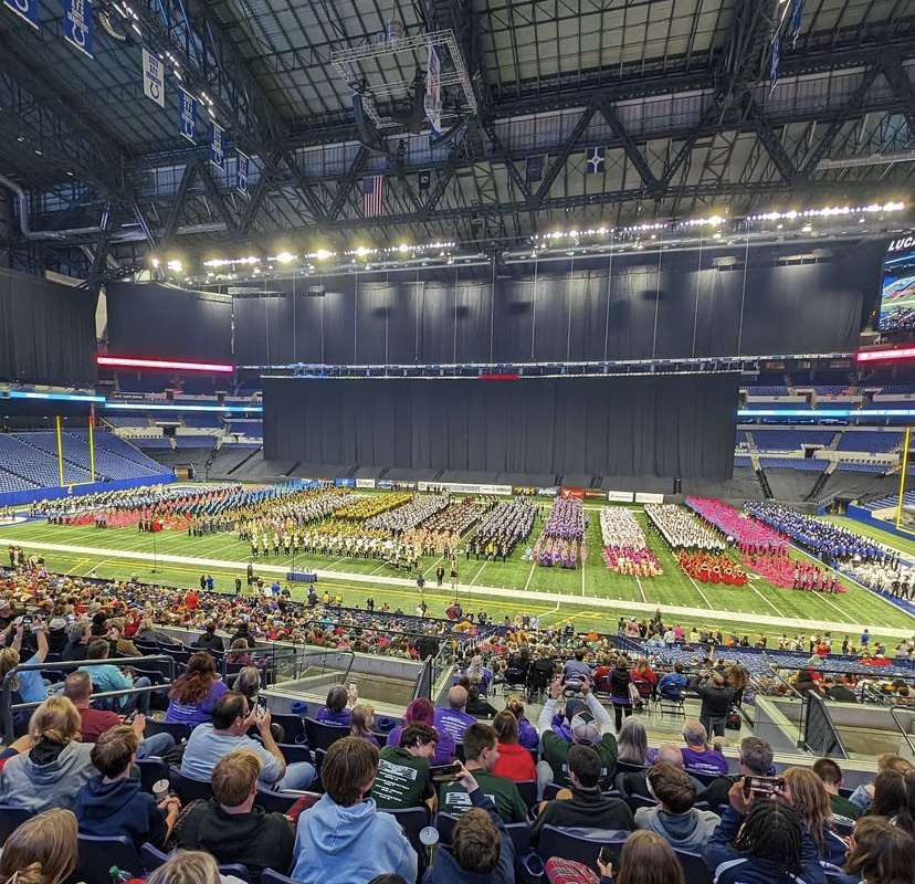 The+final+14+marching+bands+line+up+on+the+field+to+receive+their+awards+at+the+BOA+Super+Regional+competition+at+Lucas+Oil+Stadium+in+Indianapolis.+Photo+by+Matt+Wall.