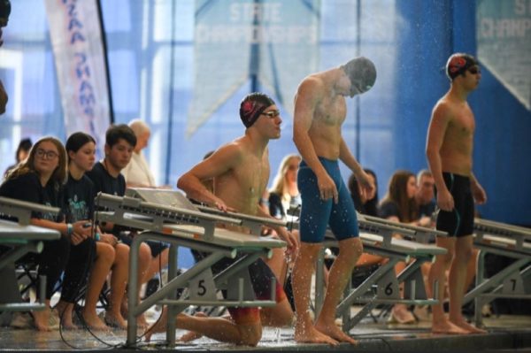 Senior Carter Crook gets ready to enter the water for his backstroke race at the state championships, 