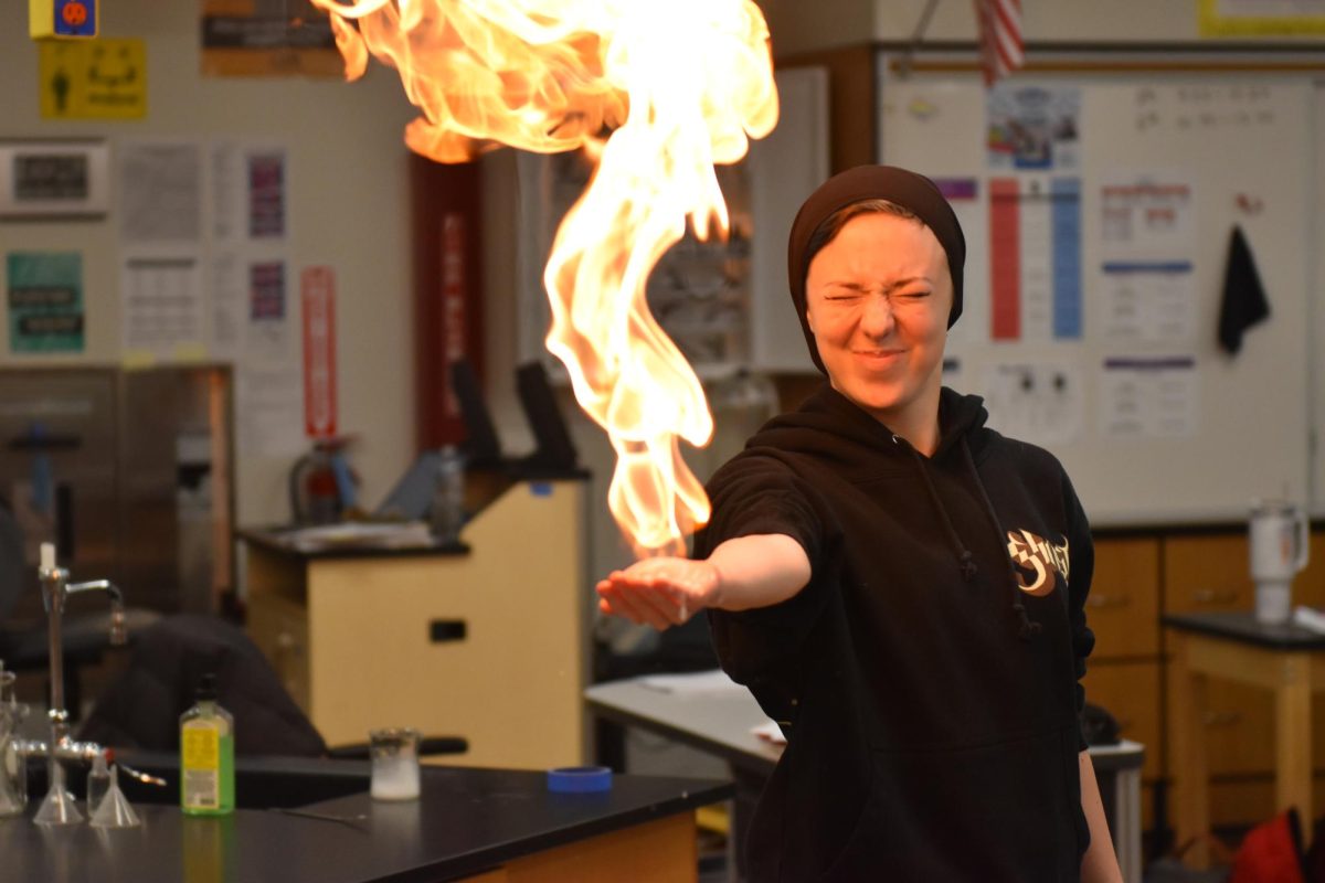 Senior Paige Holtmann demonstrates an experiment in Mr. Zinovchiks Chemistry class. Although Parkway has no plans to do so, many Missouri school districts have moved to 4-day school weeks.