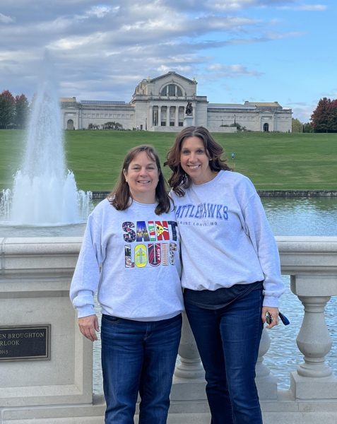 History of St. Louis teachers Amy Hubbard and Carrie Steele take a picture together in front of Art Hill during one of the class field trips. 
