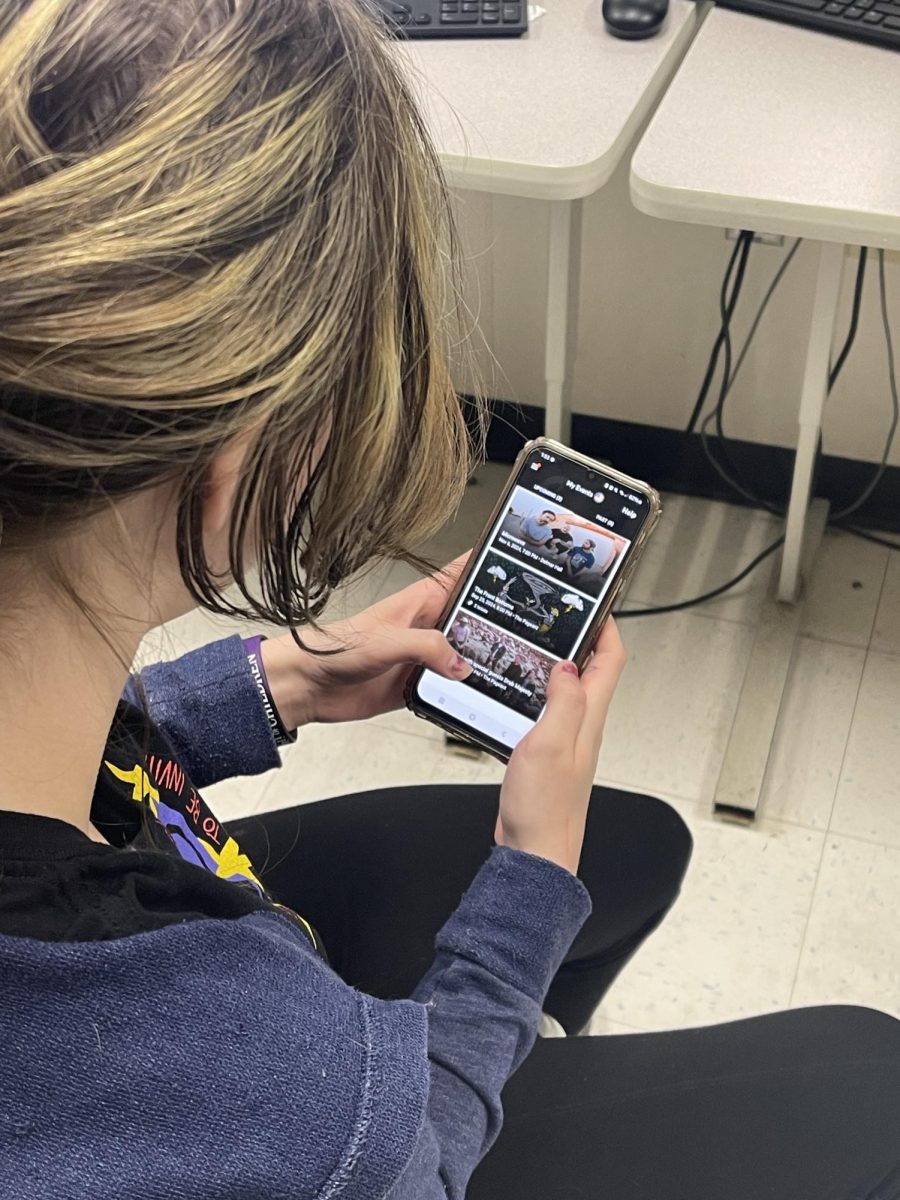 Senior Shay Fredrickson checks her upcoming Microwave concert tickets on her Ticketmaster app. 