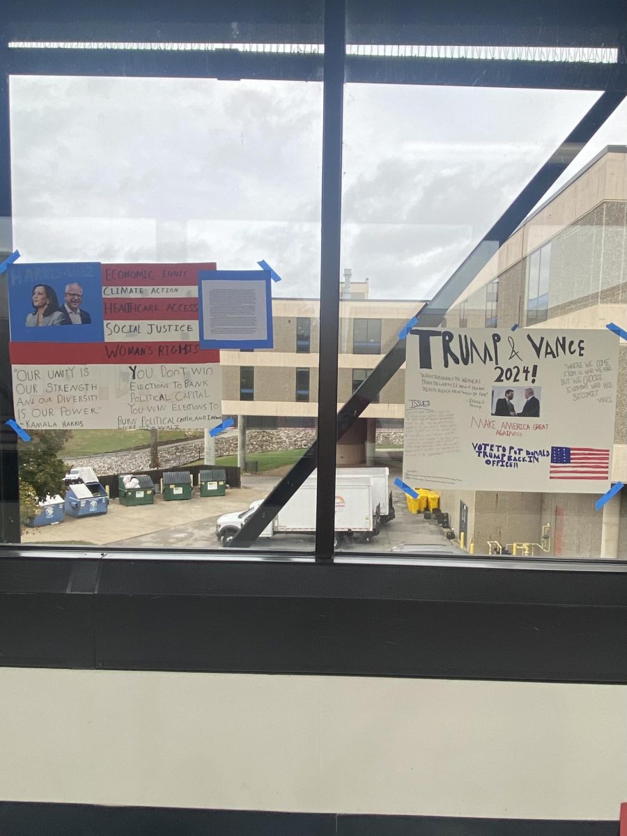 Student signs for the candidates for president and VP are displayed on the windows of the bridge to the Social Studies Wing. The students in Mr. Jennings' Government class created the signs.