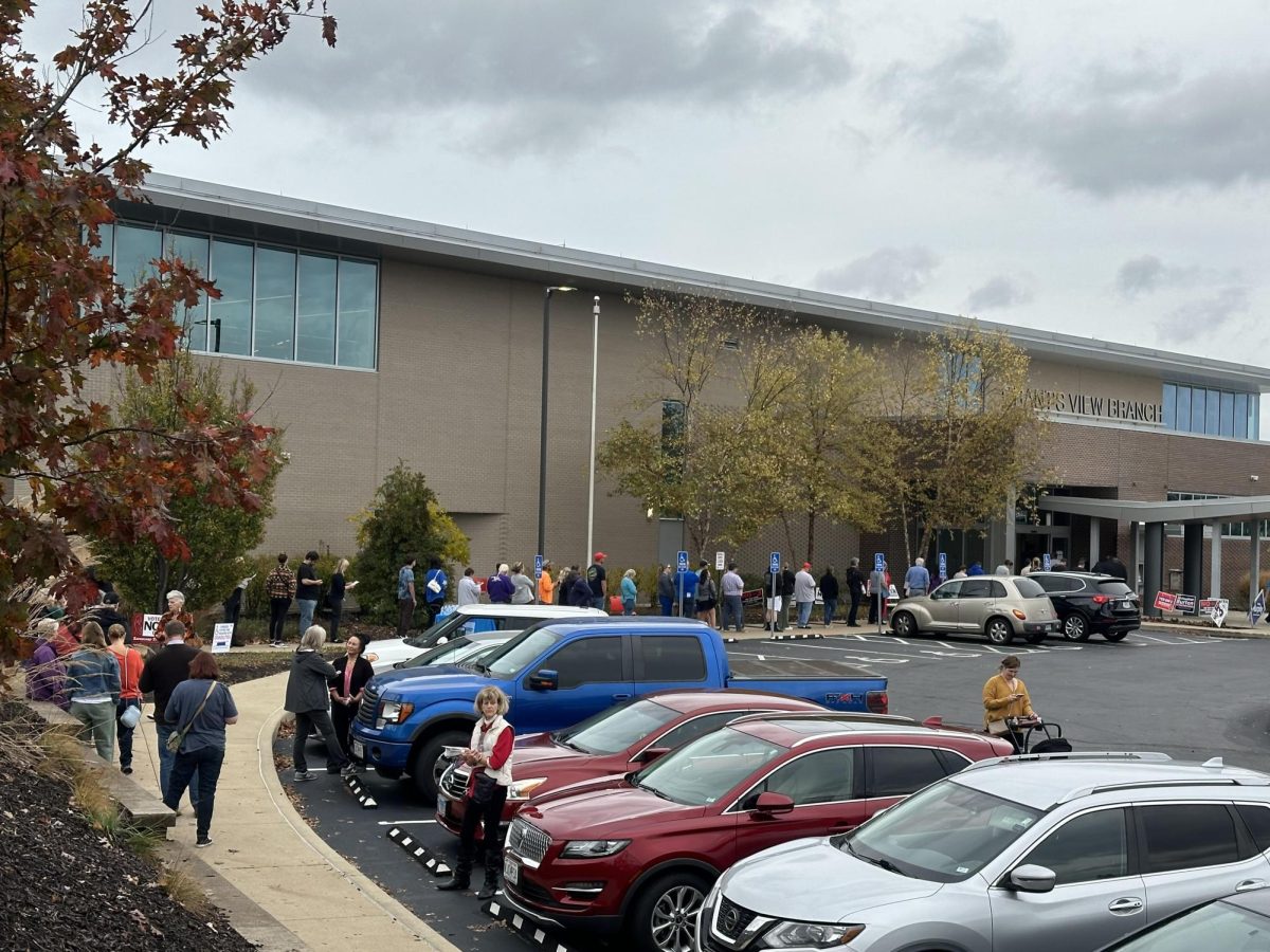 A line of early voters extends to the parking lot at the Grant's View branch of the St. Louis County Library